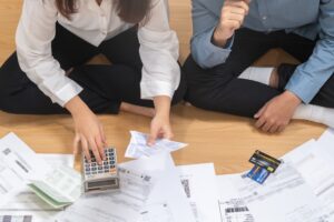 A couple looking at their finances to represent: will an iva affect my partner?