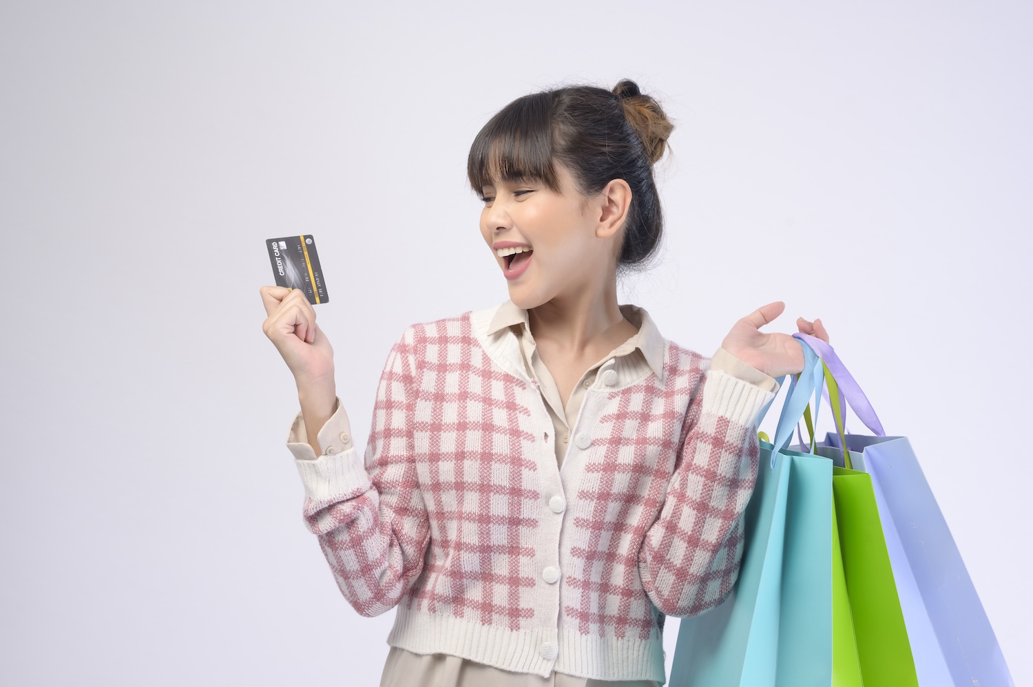 Smiling woman coping with Buy Now Pay Later Debt