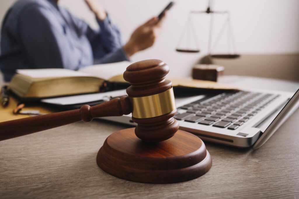 A lawyer looking on his phone thinking about what happens if you get a ccj